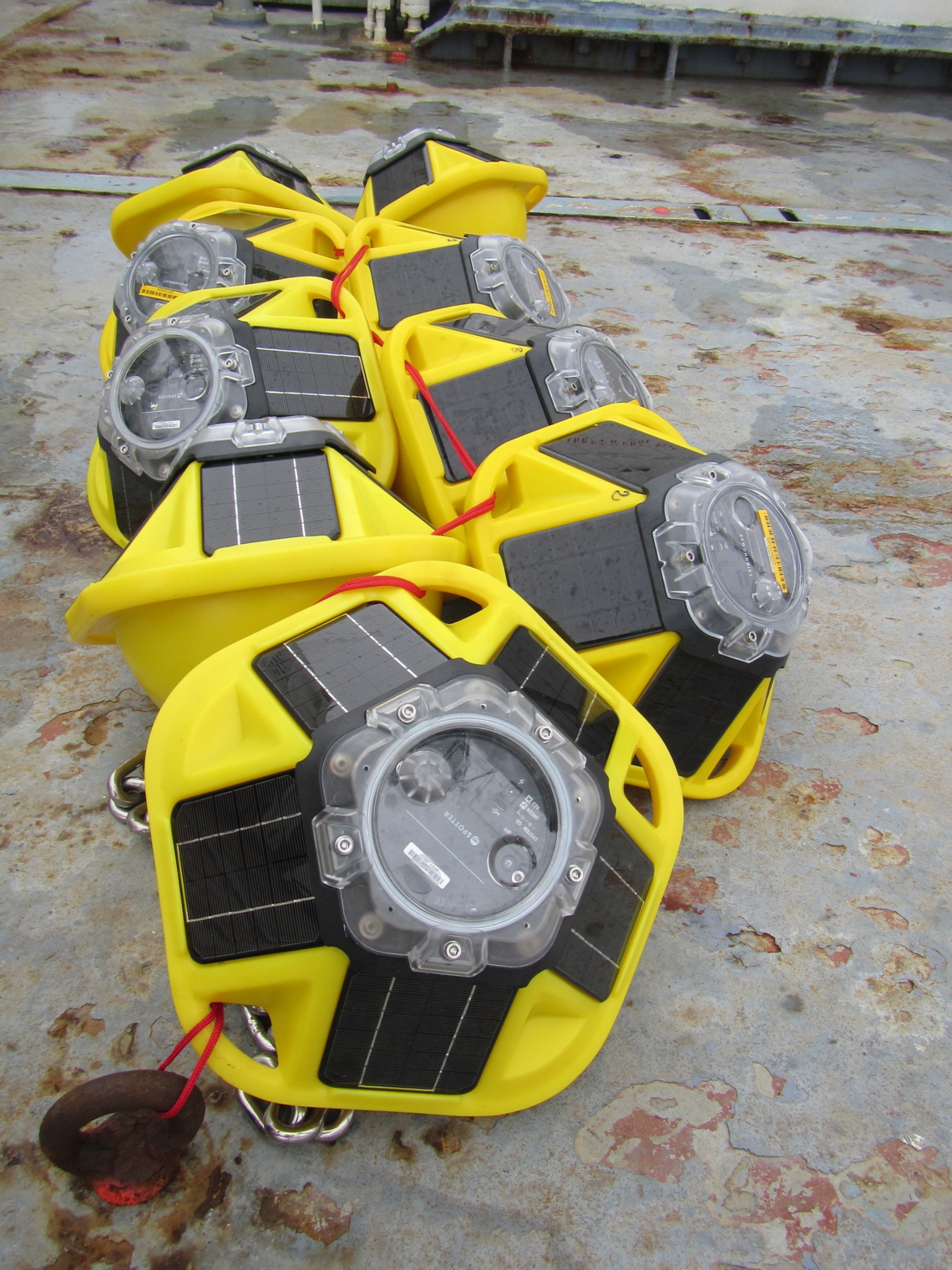 Spotter buoys awaiting deployment on the working deck of the Atalante